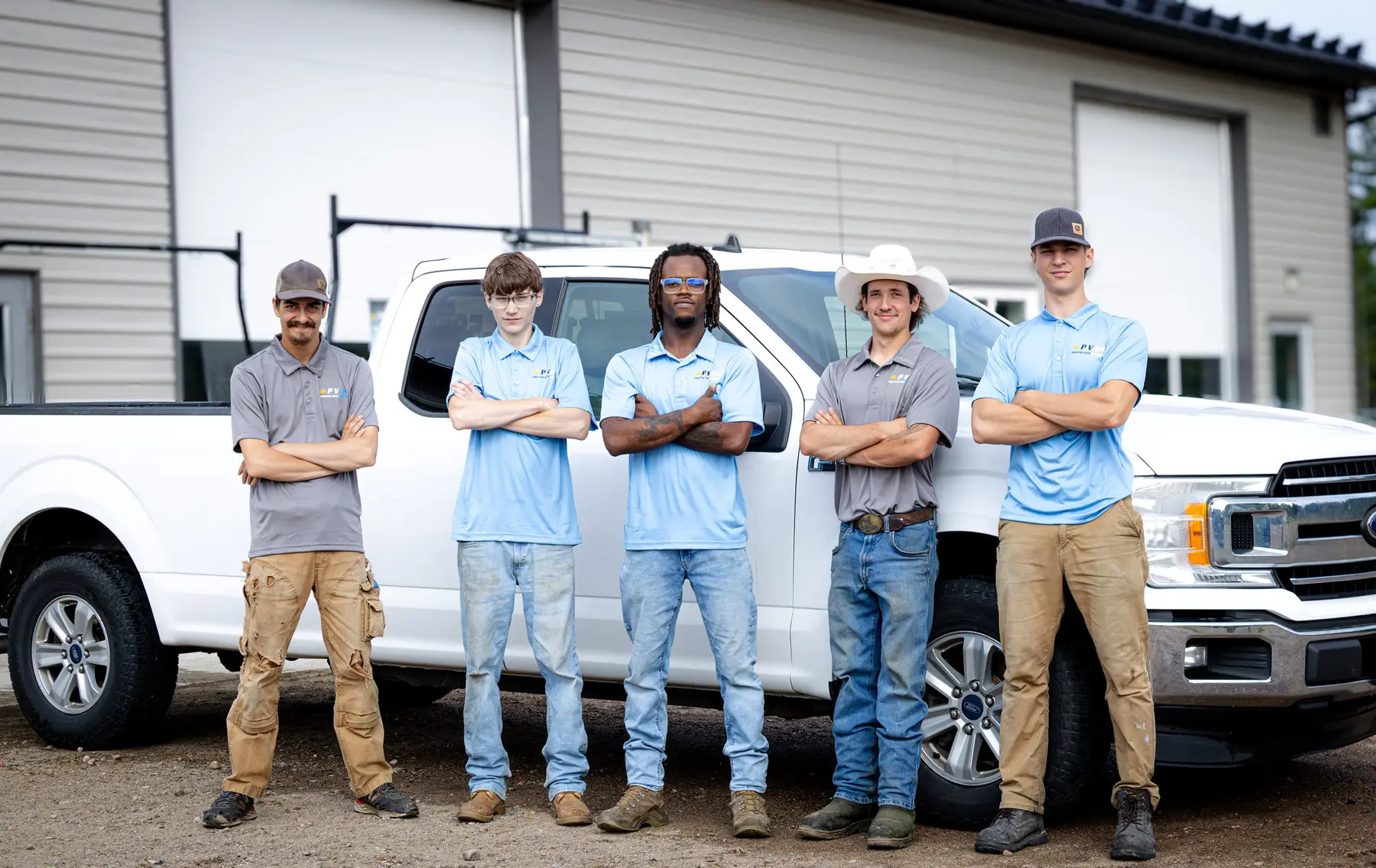 PVS crew standing in front of the truck lineup