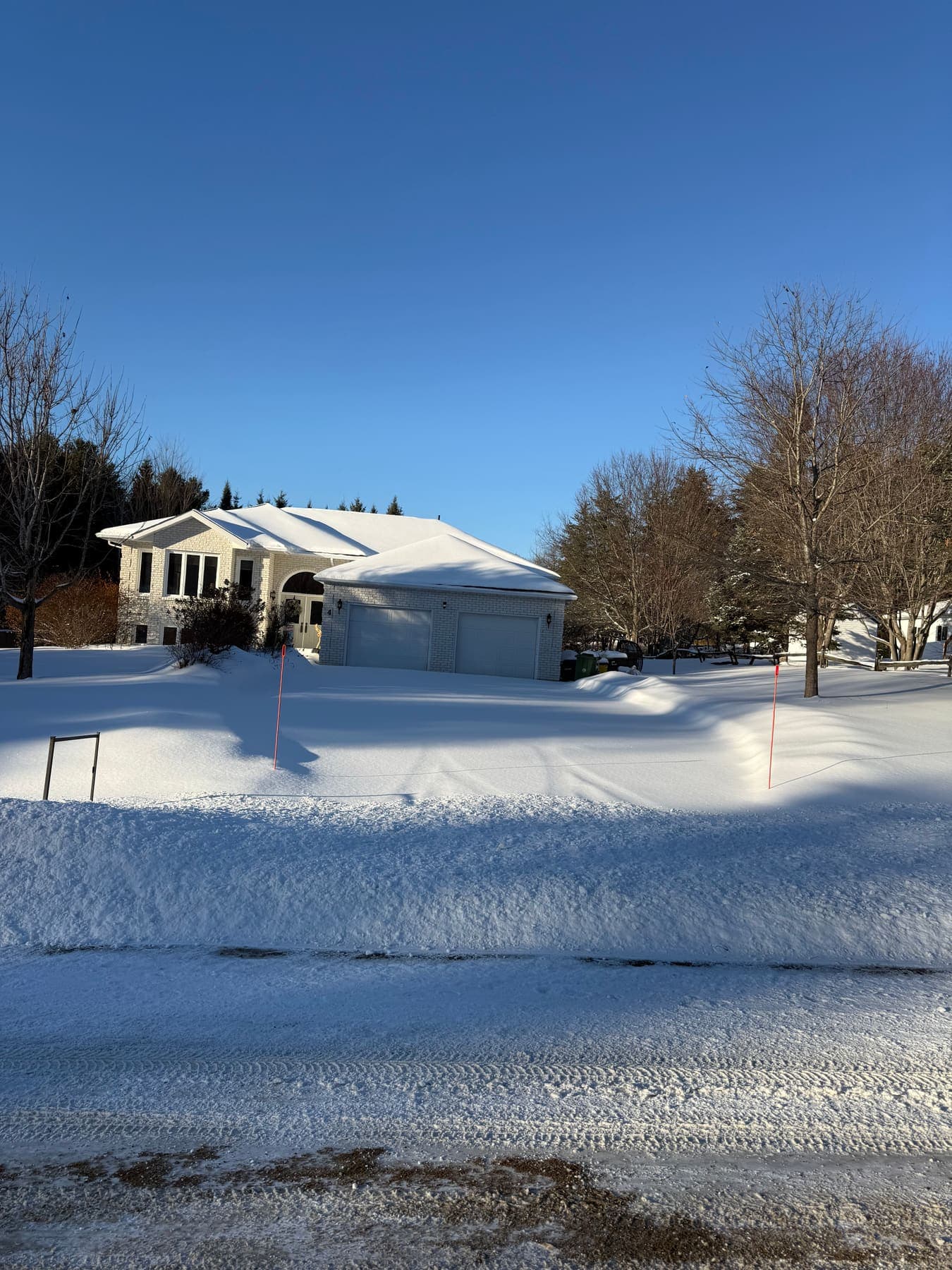 PVS SnowLand crew clearing a property after a snowfall — Ottawa Valley