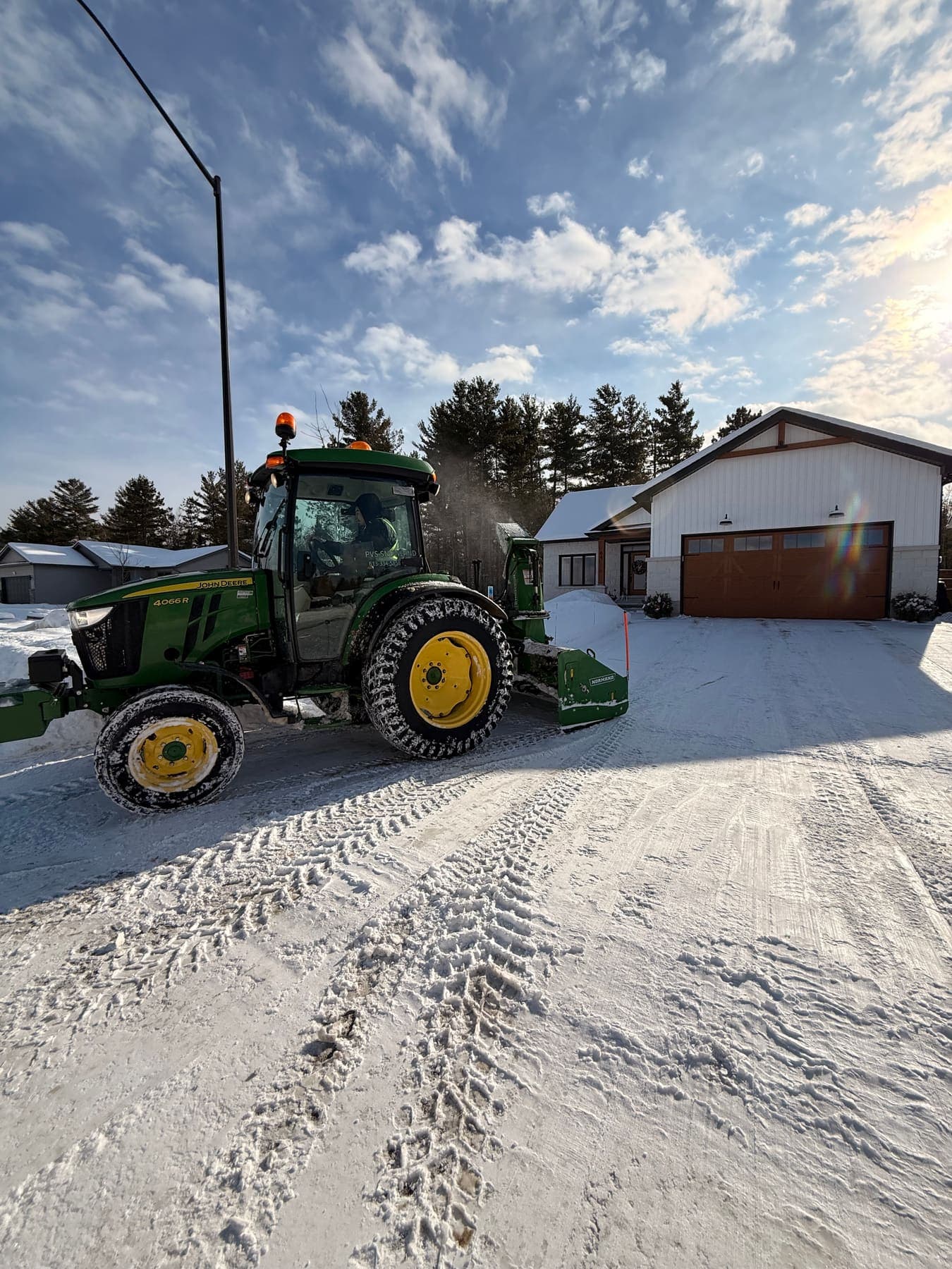 PVS SnowLand crew clearing a property after a snowfall — Ottawa Valley