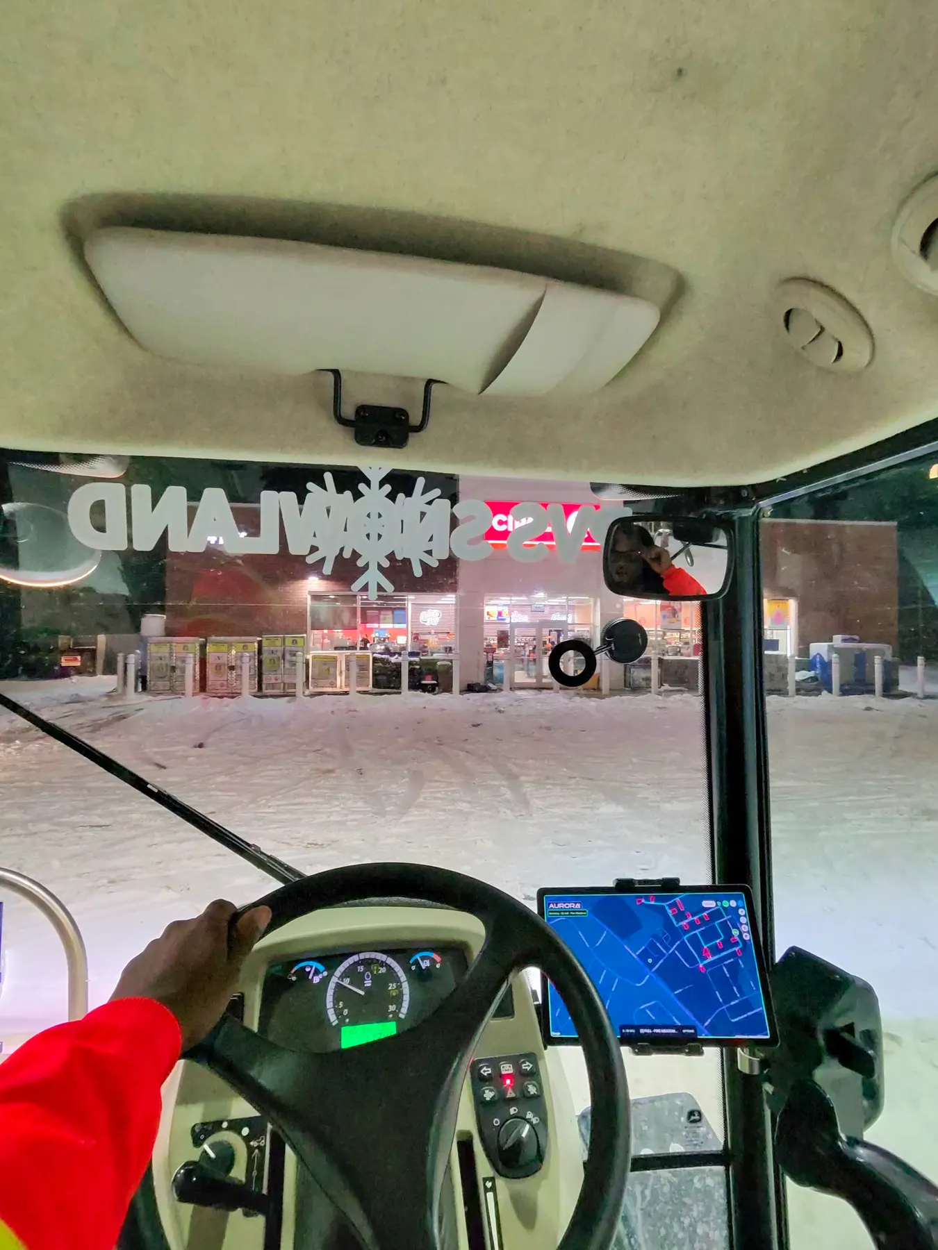 View from inside the tractor cab with the GPS route tablet during a storm run