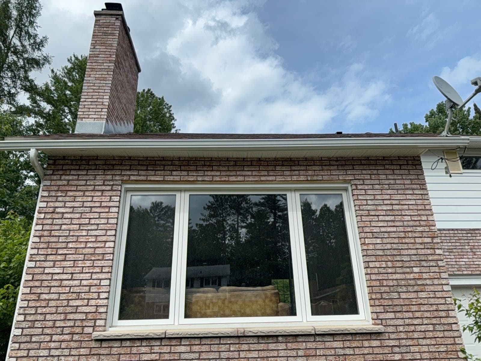 Brick residential home with large bay window cleaned by PVS in the Ottawa Valley