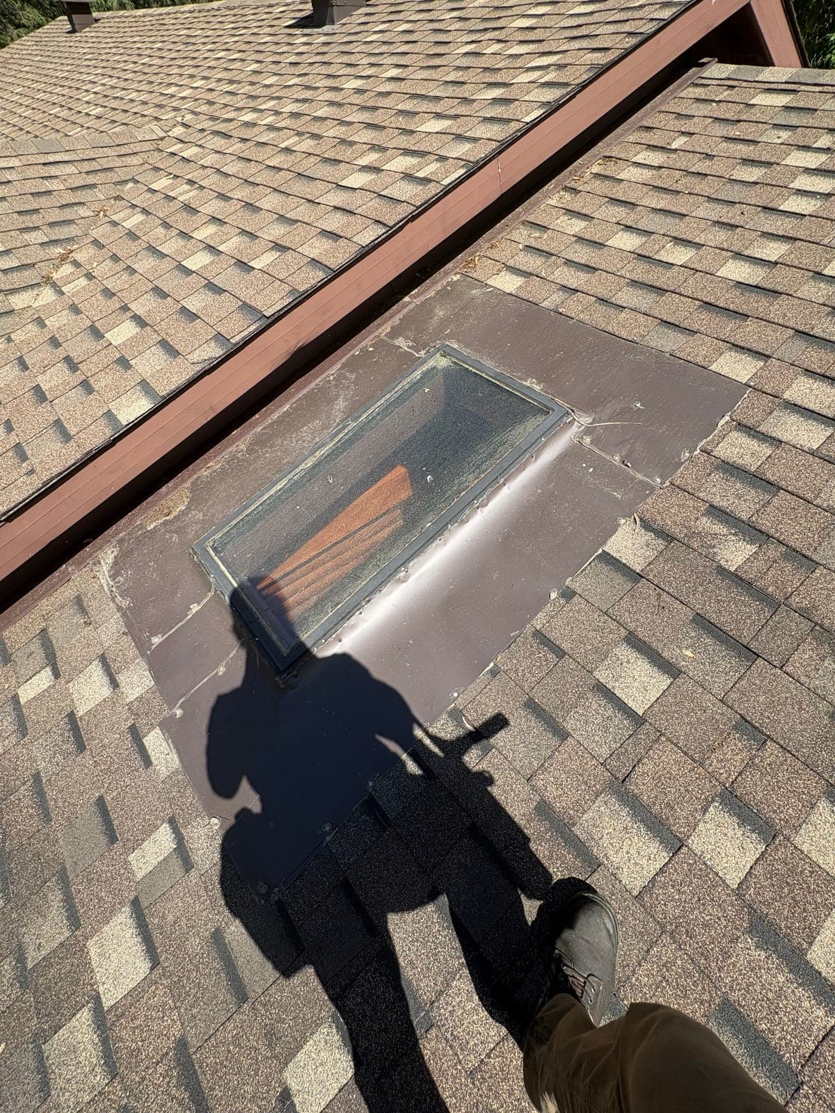 PVS technician on the roof during a skylight cleaning job